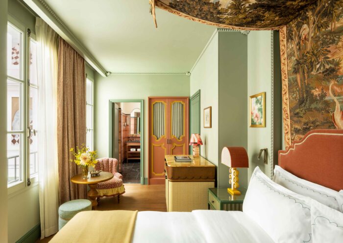 The tapestry hanging above the bed adds depth to the room