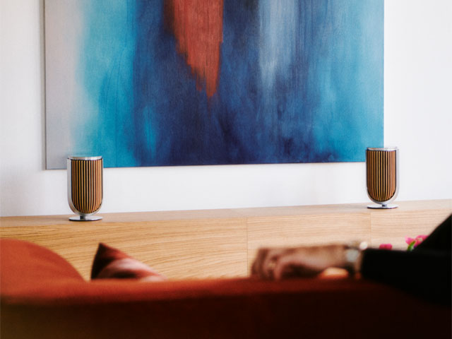 Pair of Beolab 8 smart speakers in front of abstract wall painting