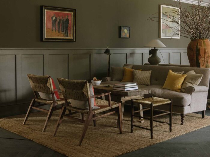 The muted and natural design details of the cosy sitting room at Heckfield Place could be easily translated to a residential home