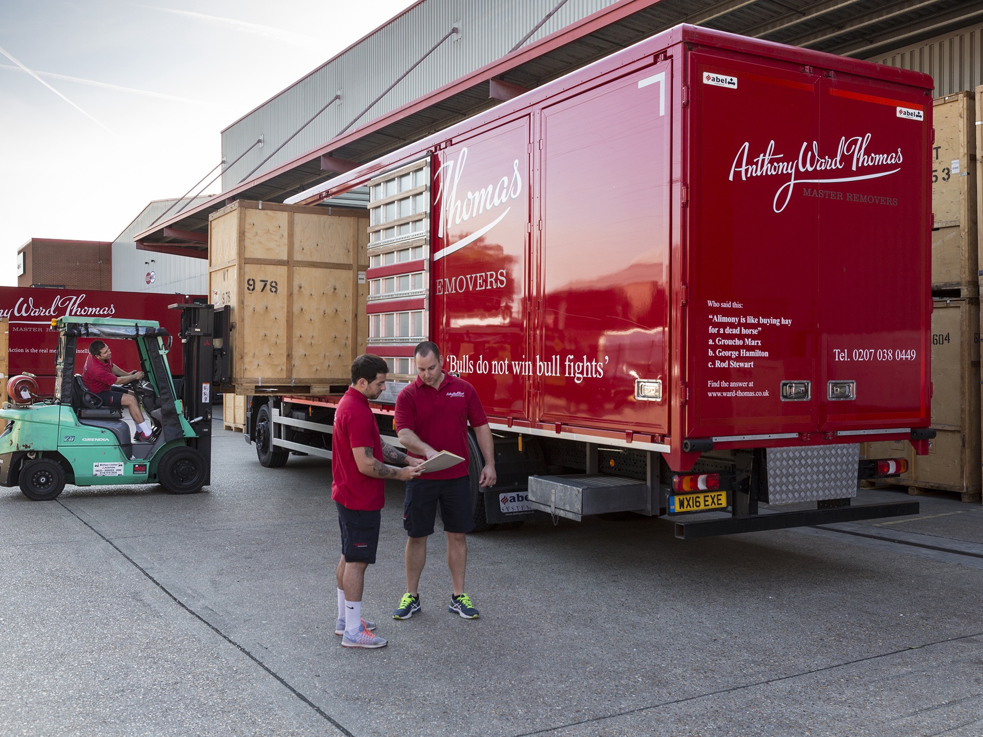 A removal van and moving men