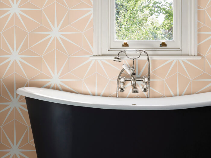 A bath in a tiled bathroom