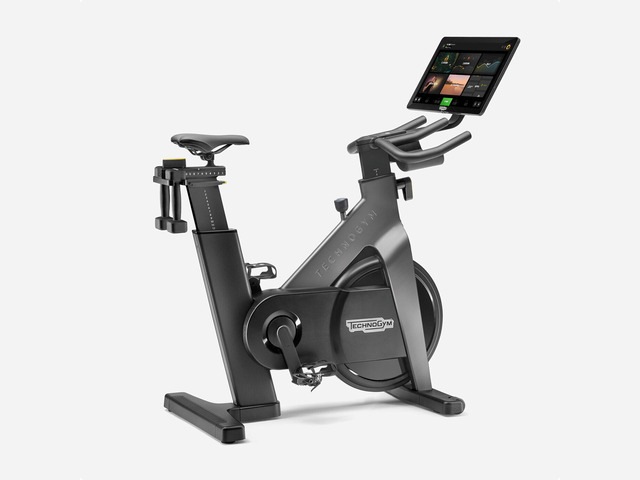 Exercise bike with tablet on white background from technogym