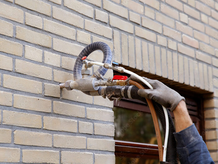 Injecting cavity wall insulation