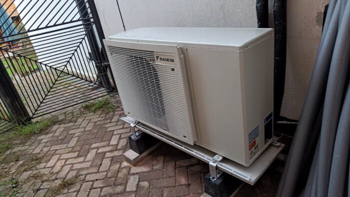 An outdoor air source heat pump. It looks a lot like an air conditioner