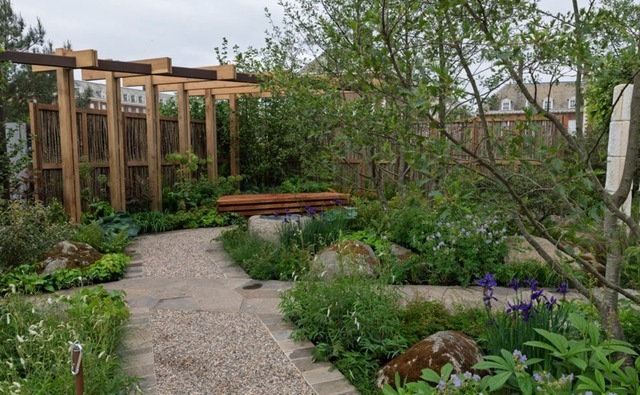 The pathway garden with pergola and bench, inspired by homelessness