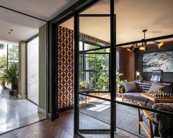 Some of the rooms are divided by glazed walls, maintaining the light throughout the home.