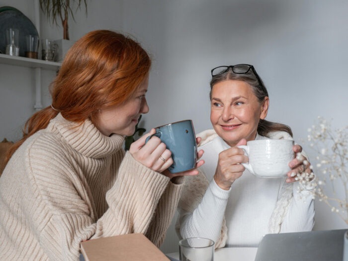 Two women chatting over coffee