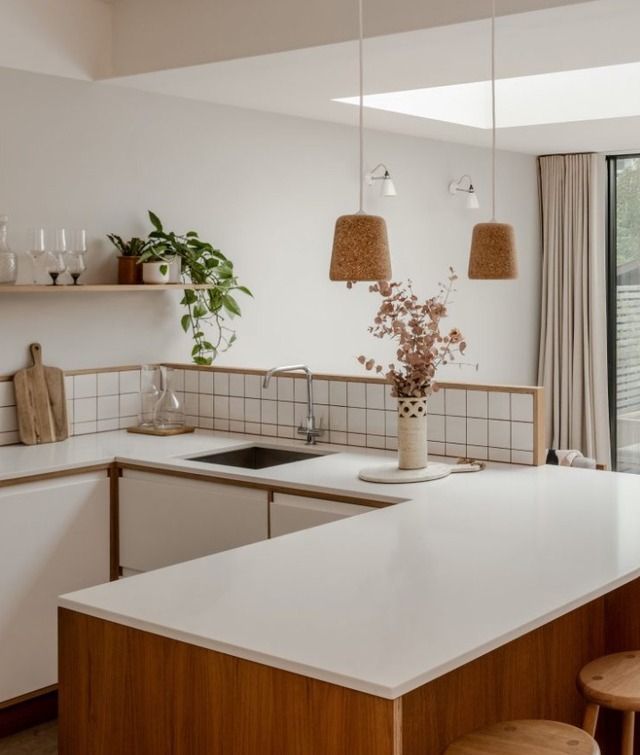 textured kitchen area of stepped extension using natural materials