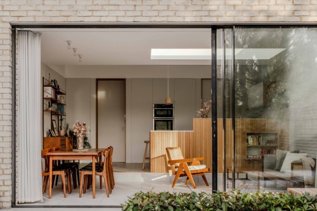 Walthamstowe stepped extension with natural materials, dining area and bifold doors