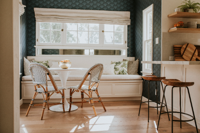 window seat in dining room with cushions and storage