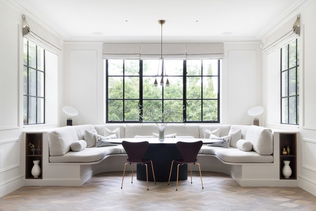 Window seat dining space with large windows