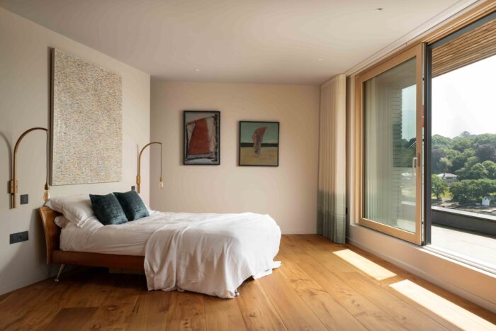 The master bedroom is located on the top level of this contemporary self build. 