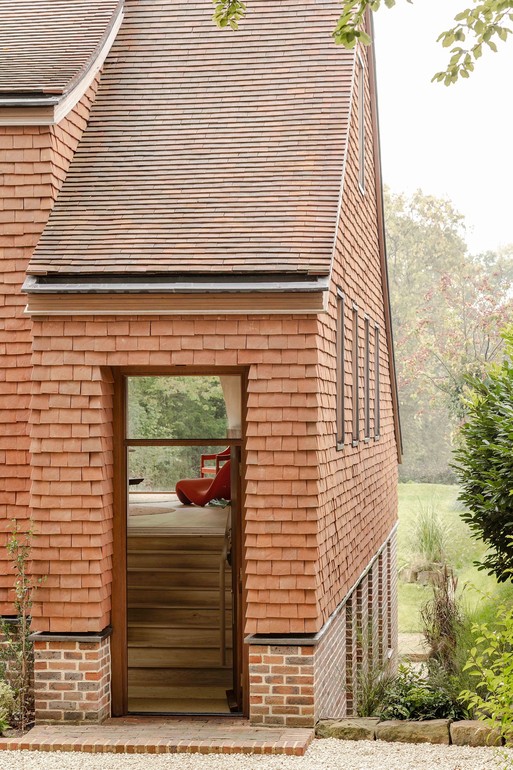 Close up of the hanging tiles and first floor door at clay rise