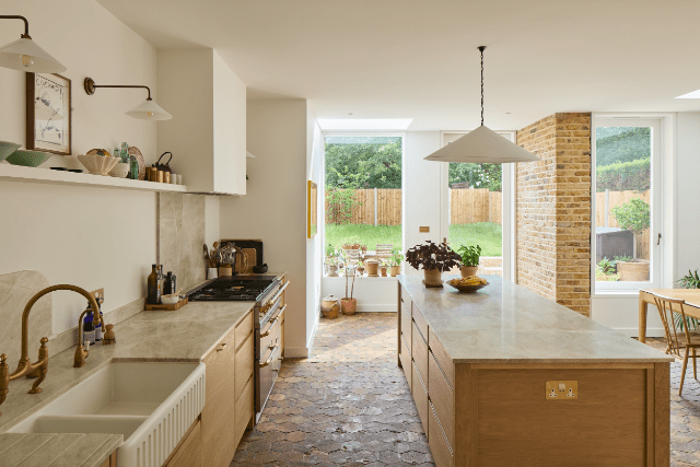 New kitchen space with repurposed terracotta tiles and views of the garden