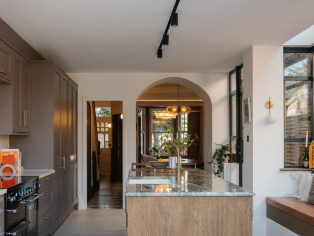New kitchen space with stunning marble counter island and lights