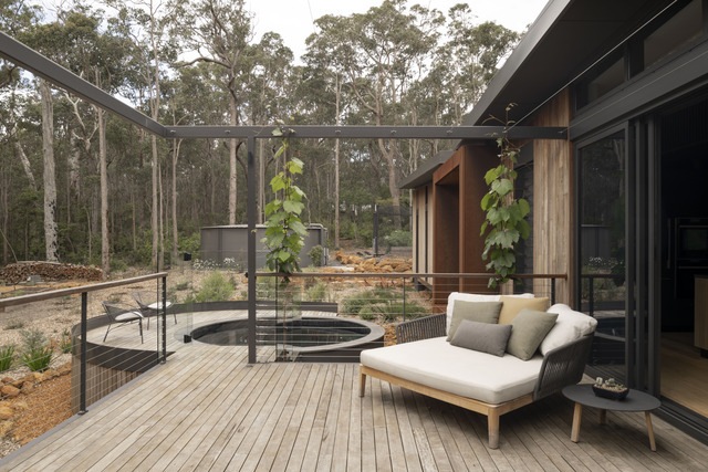Australian treehouse outside pond and seating