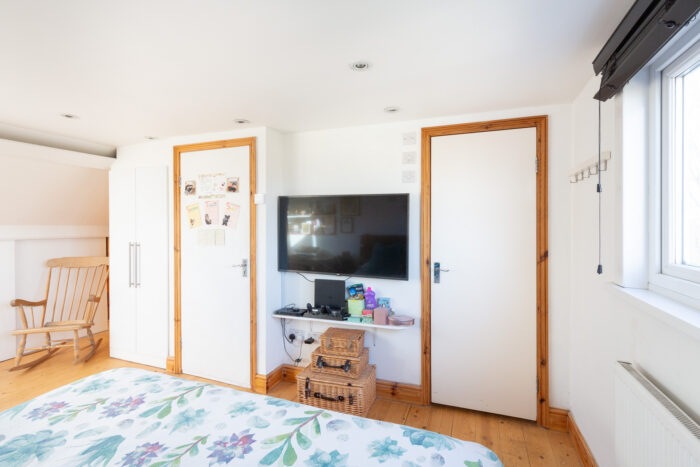 A TV between two doors