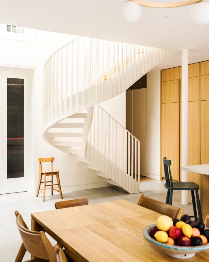 The new metal and oak spiral staircase complements the contemporary design of the kitchen .