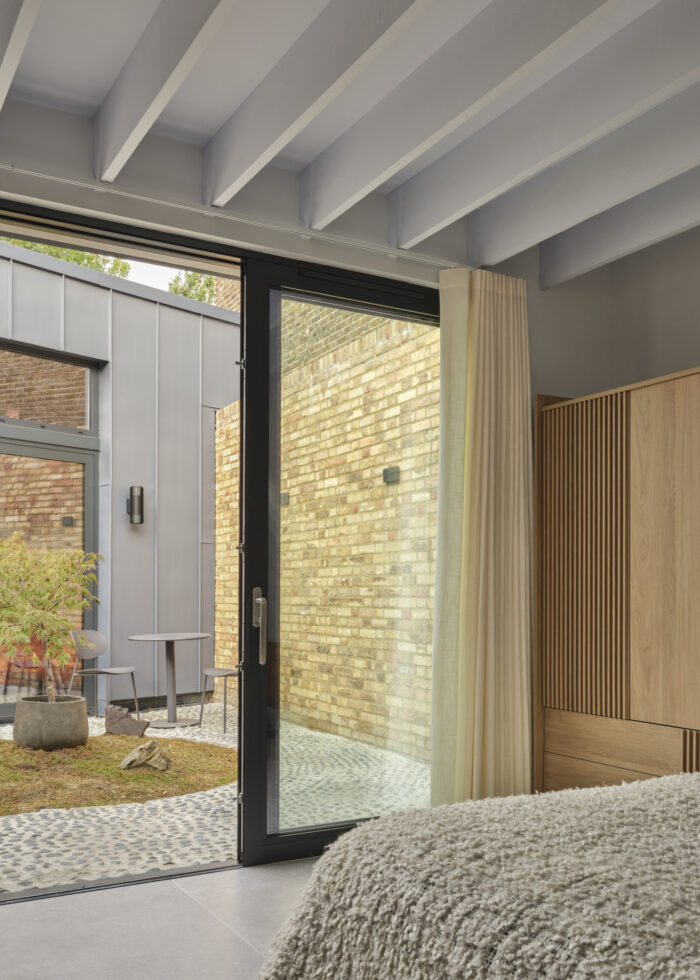 the bedroom opens onto a private courtyard