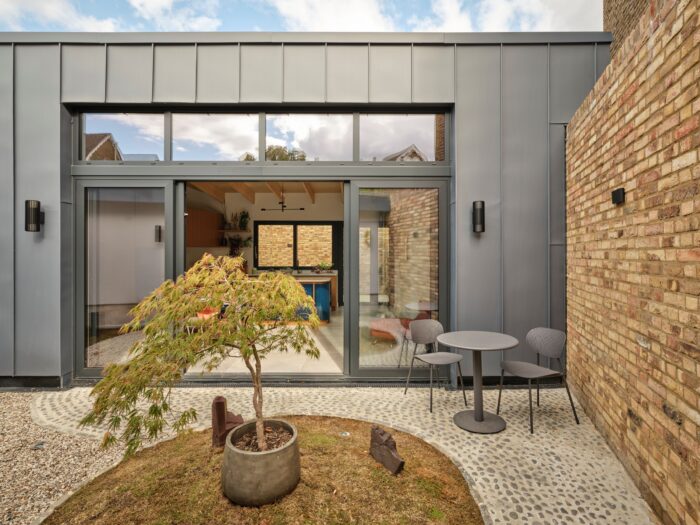 a courtyard with sliding glazed doors