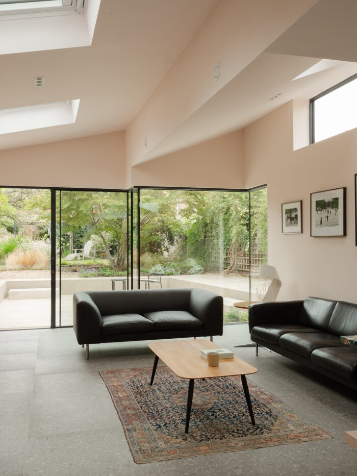 Rooflights and celestory windows flood the extension with light.