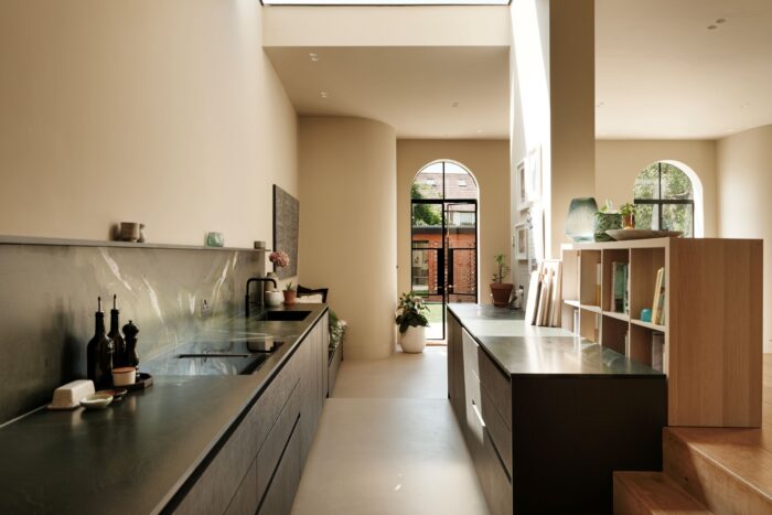 Kitchen with black cabinetry and green granite from Brazil